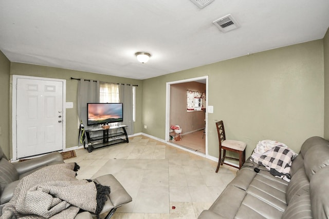 living room with light tile patterned floors