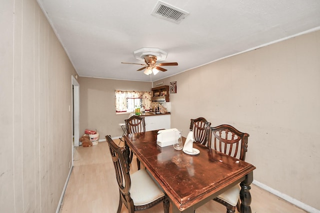 dining area featuring ceiling fan and light wood-type flooring