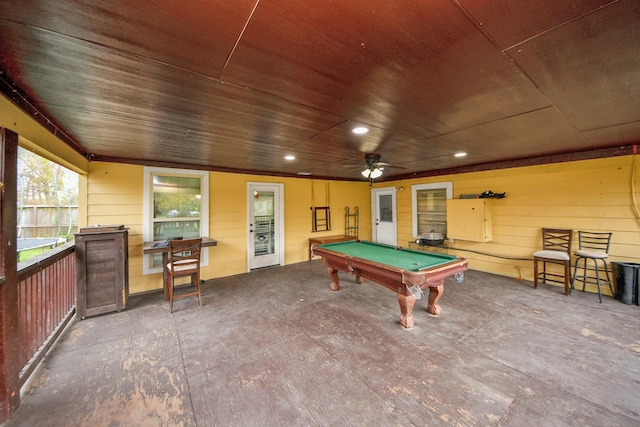 recreation room featuring billiards, ceiling fan, wooden ceiling, and wooden walls