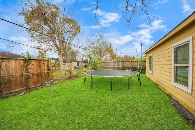 view of yard with a trampoline