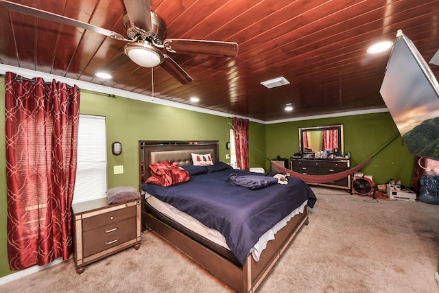 bedroom with wood ceiling, ceiling fan, light carpet, and ornamental molding