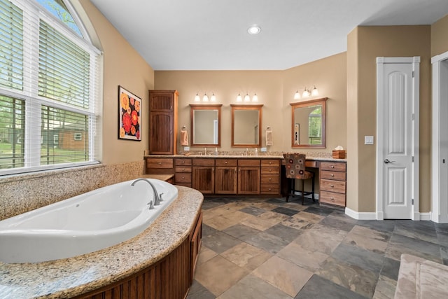 bathroom featuring a bathing tub and vanity