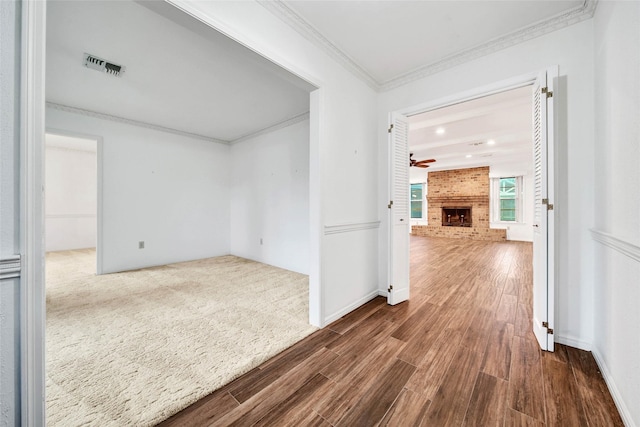 hallway featuring crown molding and dark wood-type flooring