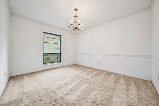 carpeted empty room with crown molding and a chandelier