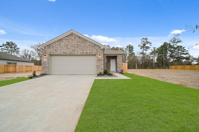 view of front of house with a garage and a front yard