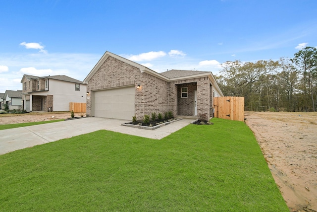 view of front of property with a garage and a front lawn