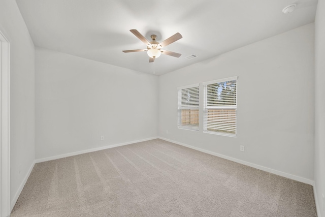 unfurnished room with carpet floors and ceiling fan