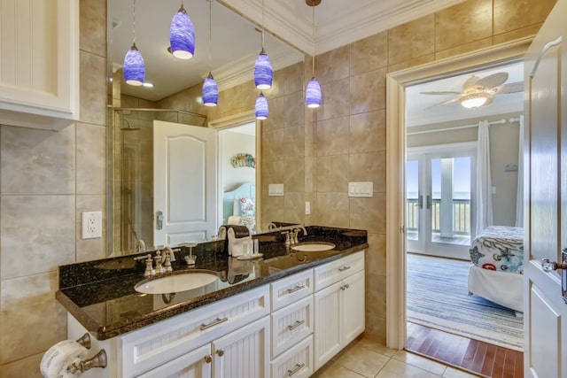 bathroom featuring tile patterned floors, ceiling fan, tile walls, and vanity