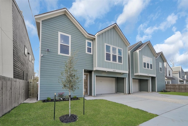 view of front facade with a front yard and a garage