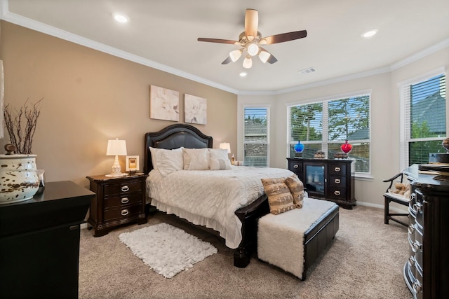 bedroom featuring ceiling fan, crown molding, and light carpet