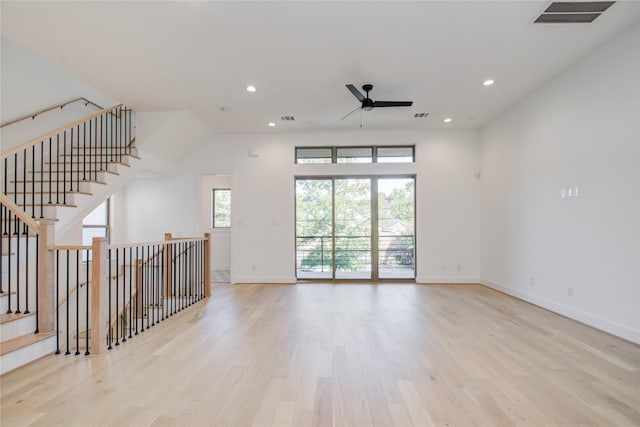 unfurnished living room with ceiling fan and light wood-type flooring