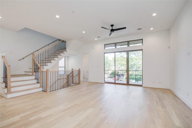 unfurnished living room featuring ceiling fan and light hardwood / wood-style flooring