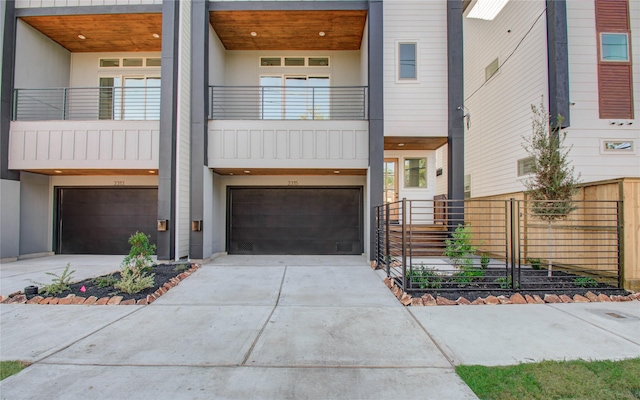 view of front of home featuring a balcony and a garage