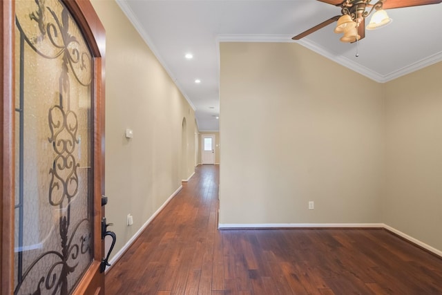 entrance foyer with dark hardwood / wood-style flooring, ceiling fan, and ornamental molding