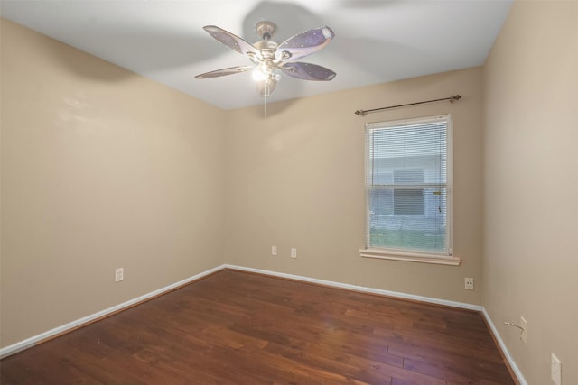 empty room featuring ceiling fan and dark wood-type flooring