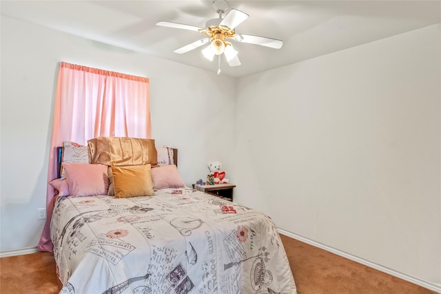 bedroom featuring ceiling fan and carpet