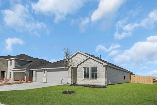 view of front of house with a garage and a front lawn