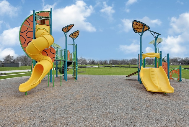 view of jungle gym with a lawn