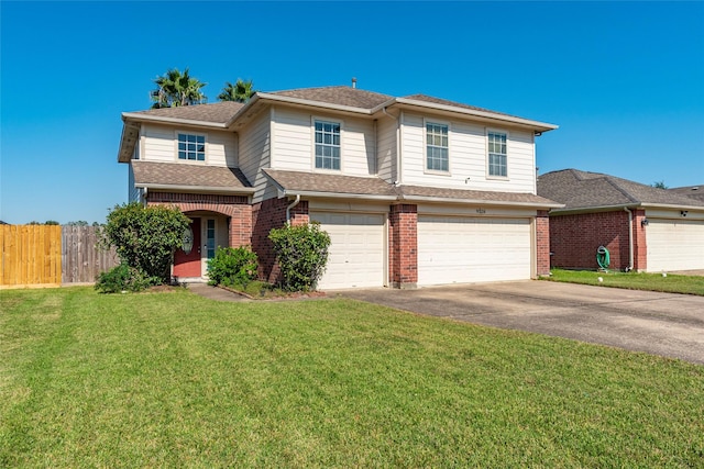 view of property featuring a front yard and a garage