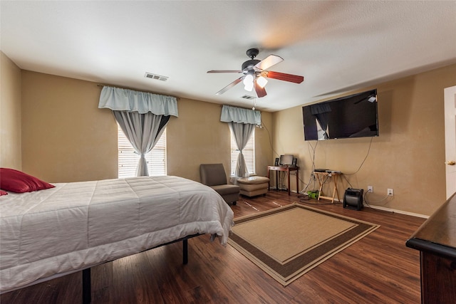 bedroom featuring ceiling fan and dark wood-type flooring