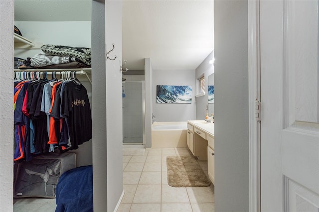 bathroom with vanity, tile patterned floors, and independent shower and bath