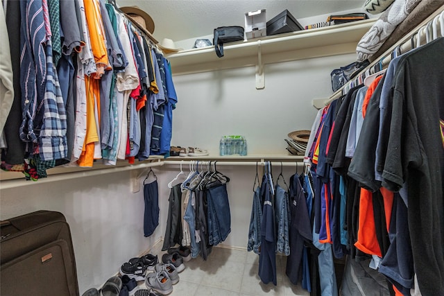 walk in closet featuring light tile patterned floors