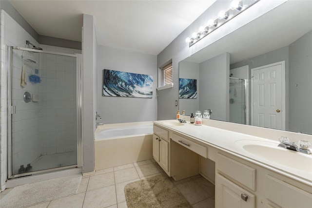 bathroom with tile patterned flooring, shower with separate bathtub, and vanity