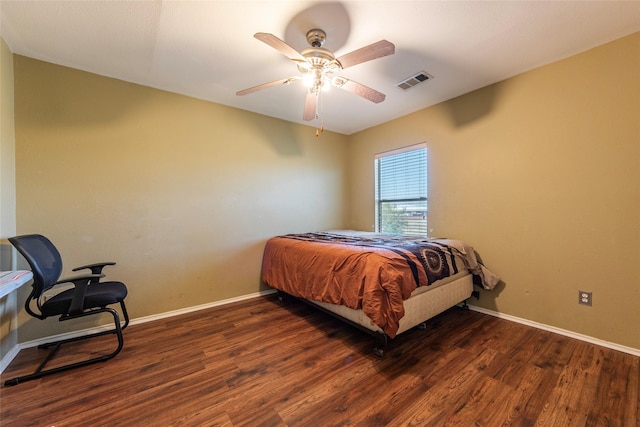 bedroom featuring ceiling fan and dark hardwood / wood-style floors