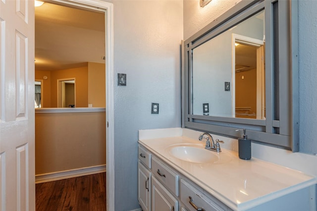 bathroom featuring vanity and hardwood / wood-style flooring