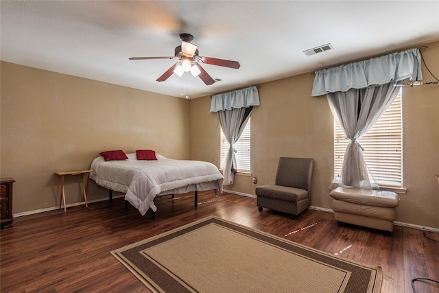 bedroom featuring ceiling fan and dark hardwood / wood-style flooring