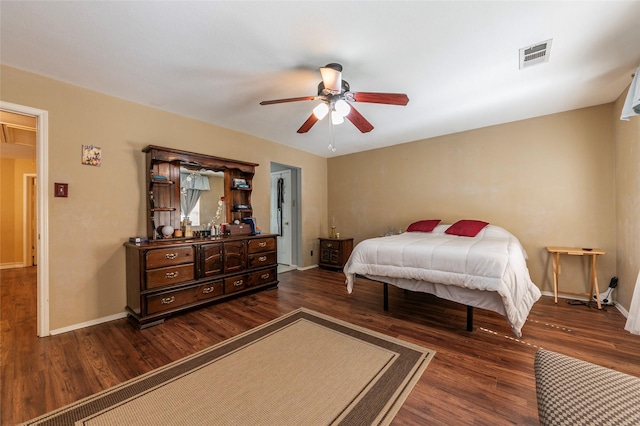 bedroom with ceiling fan and dark wood-type flooring