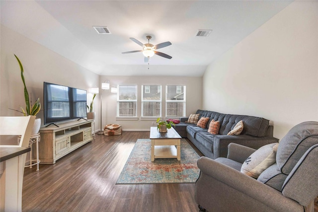 living room featuring ceiling fan, dark hardwood / wood-style flooring, and lofted ceiling