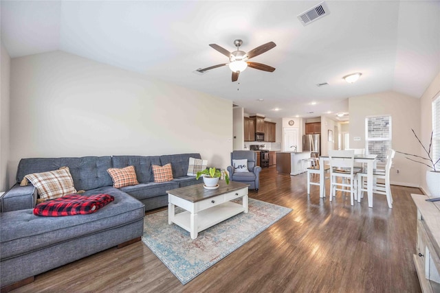 9211 Melmack Dr, Rosharon, TX 77583 - living area with lofted ceiling, ceiling fan, dark wood-style flooring, and recessed lighting