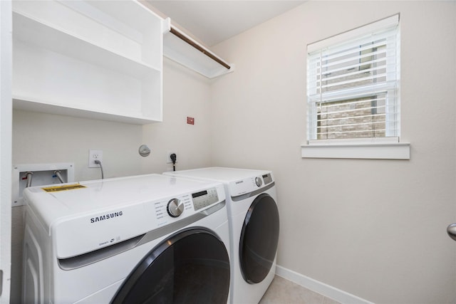 9211 Melmack Dr, Rosharon, TX 77583 - laundry room featuring separate washer and dryer and baseboards