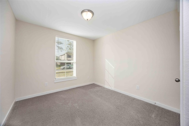9211 Melmack Dr, Rosharon, TX 77583 - carpeted empty room with baseboards