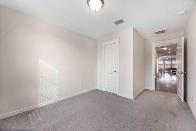9211 Melmack Dr, Rosharon, TX 77583 - unfurnished bedroom featuring baseboards and carpet flooring