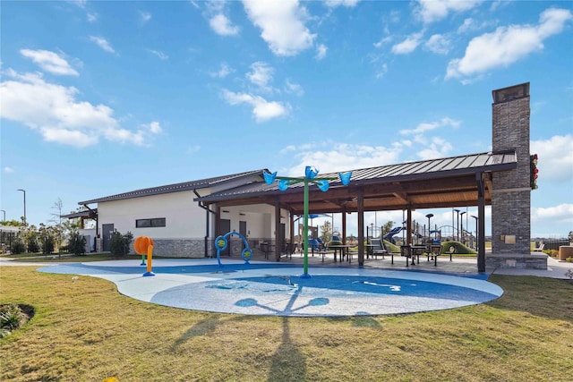 view of pool featuring a yard