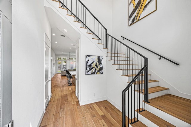 stairs featuring wood-type flooring