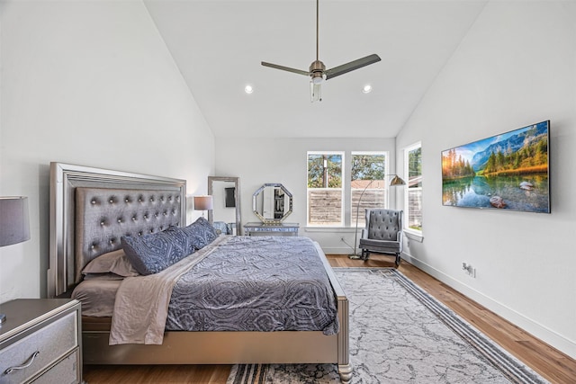 bedroom featuring ceiling fan, high vaulted ceiling, and wood-type flooring