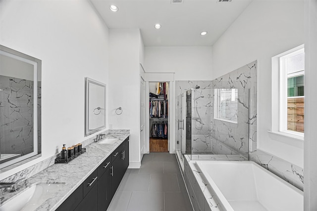 bathroom with vanity, tile patterned floors, and independent shower and bath