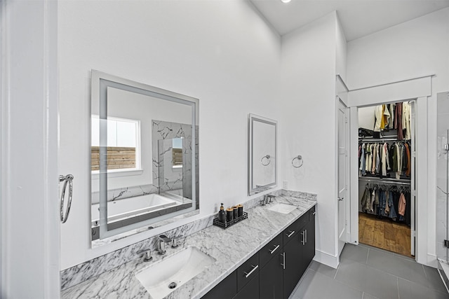 bathroom featuring tile patterned flooring, vanity, and independent shower and bath