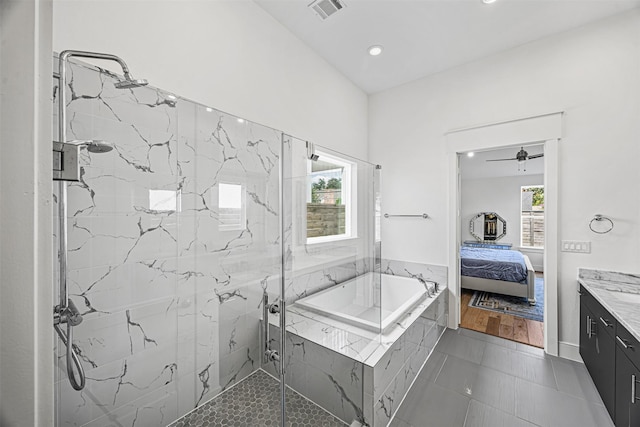 bathroom with tile patterned flooring, vanity, ceiling fan, and shower with separate bathtub