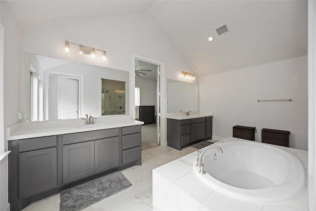 bathroom featuring vaulted ceiling, independent shower and bath, vanity, and ceiling fan