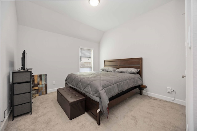 carpeted bedroom featuring lofted ceiling