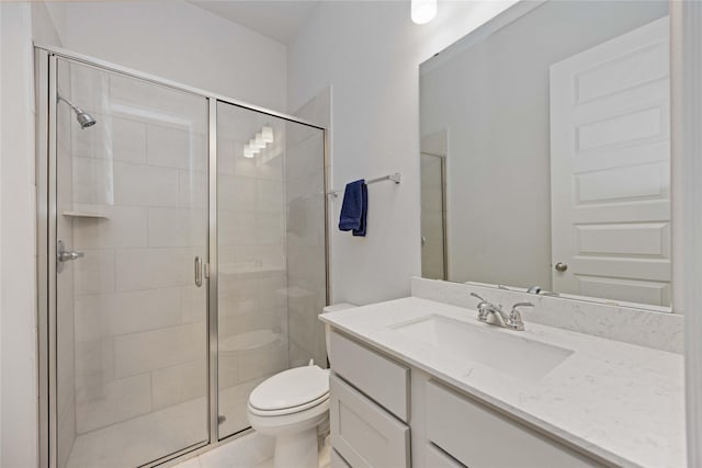 bathroom featuring an enclosed shower, vanity, tile patterned floors, and toilet