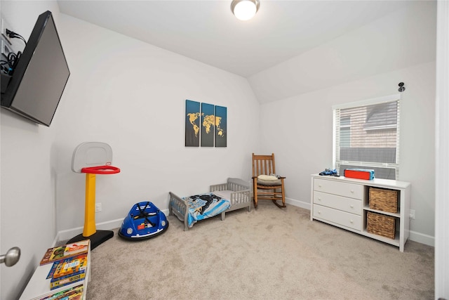 recreation room featuring light carpet and lofted ceiling