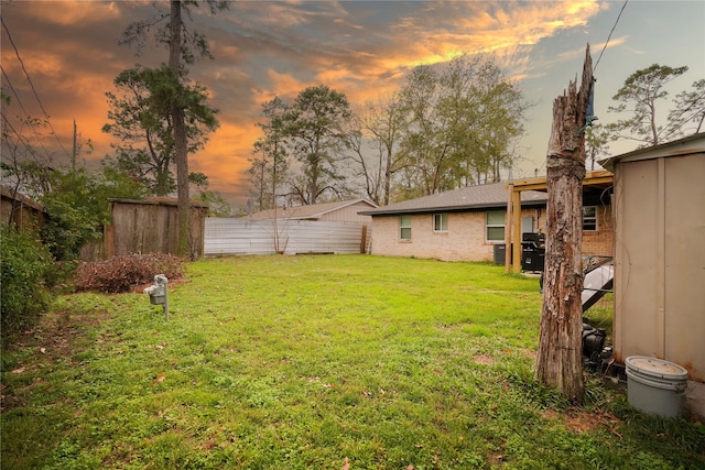 view of yard at dusk