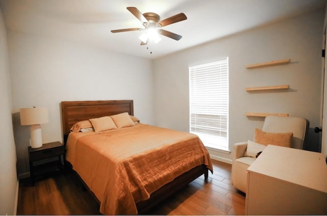 bedroom featuring hardwood / wood-style flooring and ceiling fan