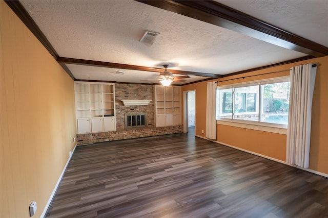 unfurnished living room with dark hardwood / wood-style flooring, a brick fireplace, a textured ceiling, ceiling fan, and built in features