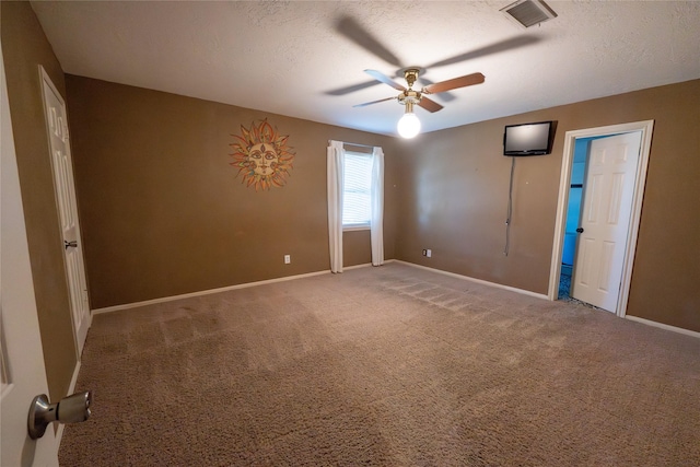 unfurnished room featuring carpet, a textured ceiling, and ceiling fan